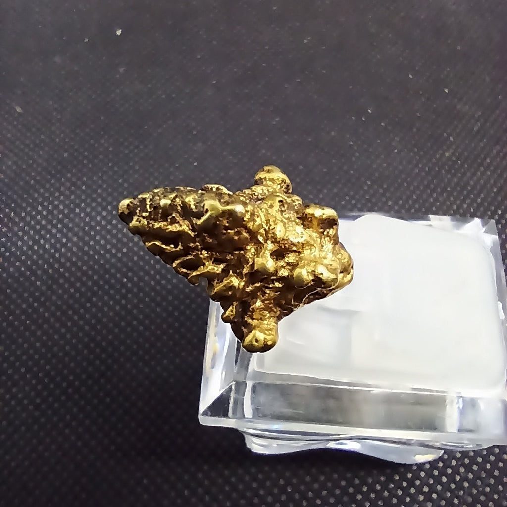 Ancient Javanese Gold Earpiece figurine side view